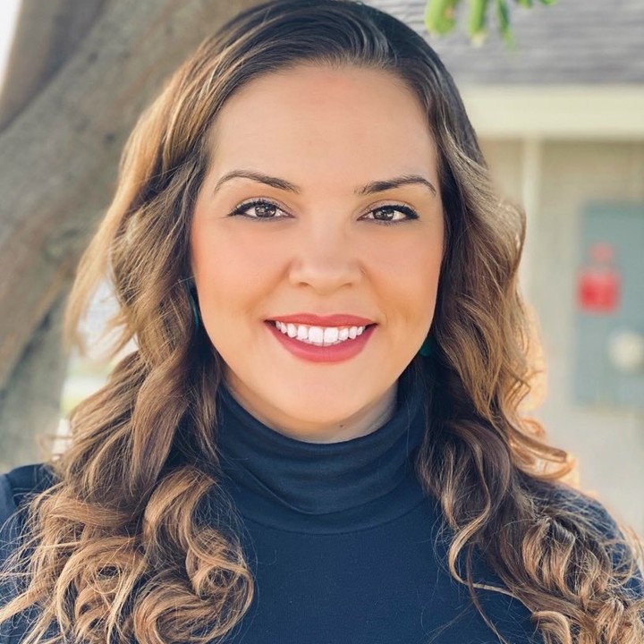 Ashley Saldana, Licensed Clinical Social Worker and founder of Blue Jay Family Services, smiling outdoors